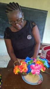 Mrs Olivia Fonnie, member Prison Ministry demonstrates to inmates at Remand Home how to design flowers 
